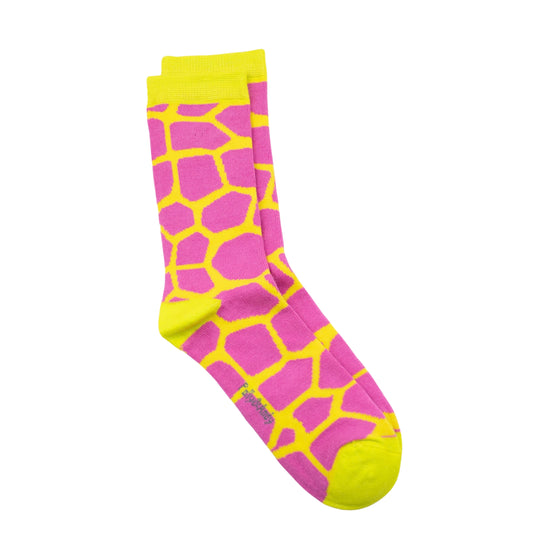 A pair of seamless soft top bamboo crew socks with a bright pink and neon yellow giraffe-print pattern, featuring a neon yellow cuff, heel, toe, and sole, shown against a plain white background.